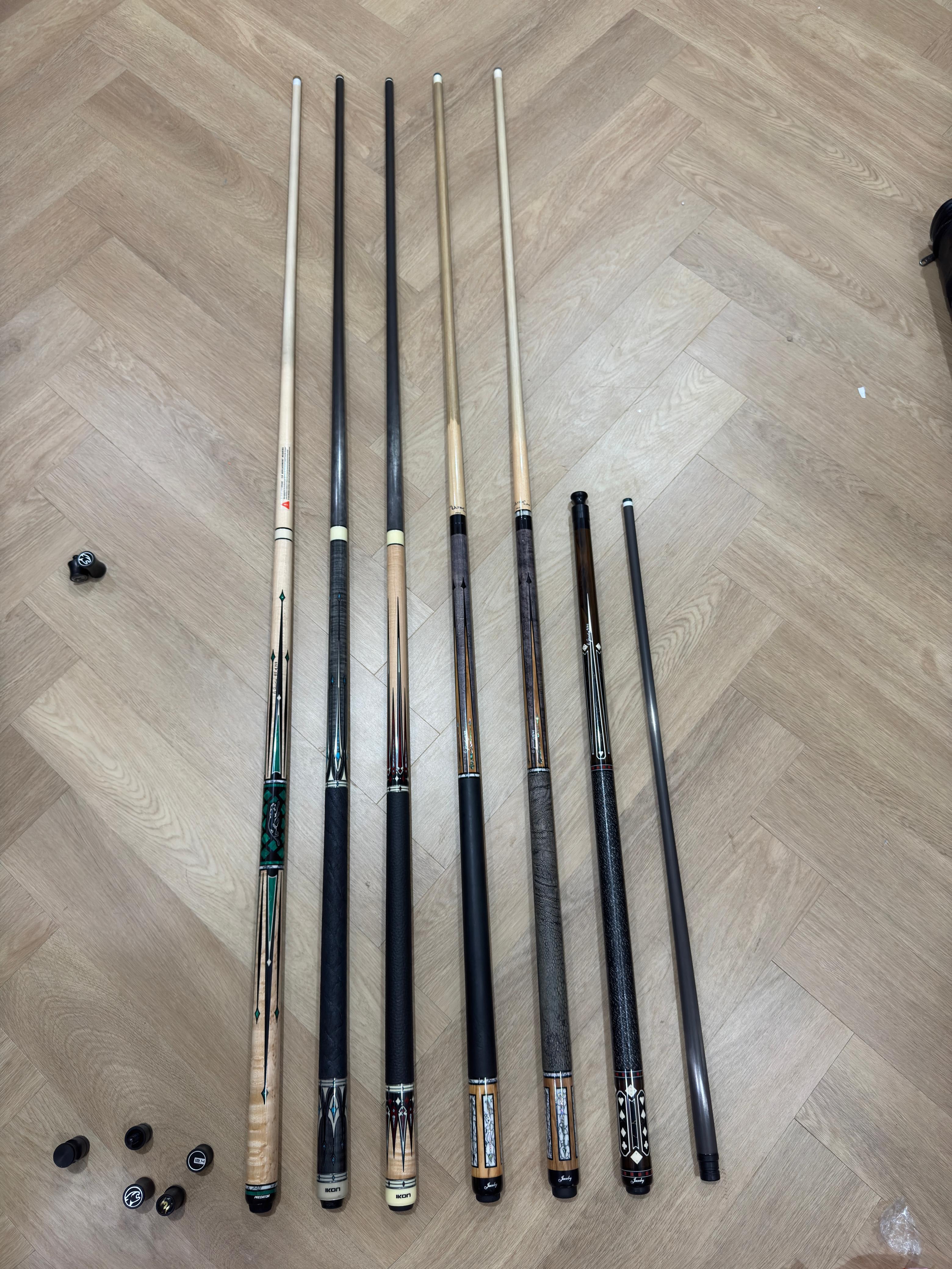 A wide selection of high-quality billiard cues on display